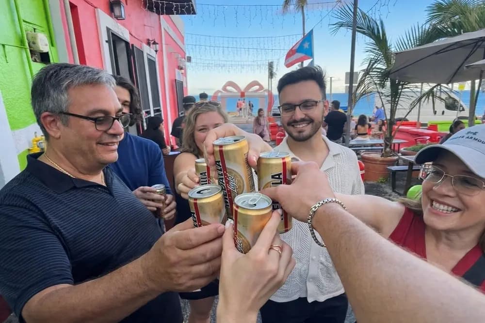 Guests enjoying a local beer during a Bori Local Tours outing in Old San Juan