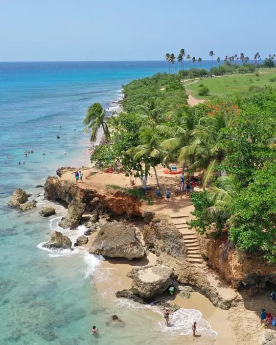 Turquoise water and palms along Peña Blanca beach in Aguadilla